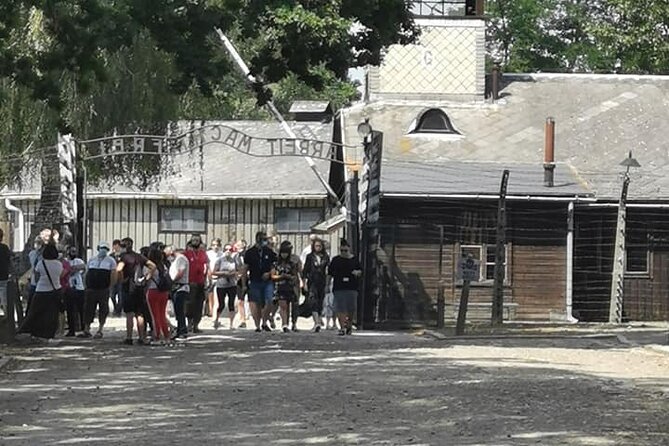 CV-Visit to the Auschwitz Camp in Italian with departure from Krakow - Auschwitz I: Entering Through the Gate and First Impressions