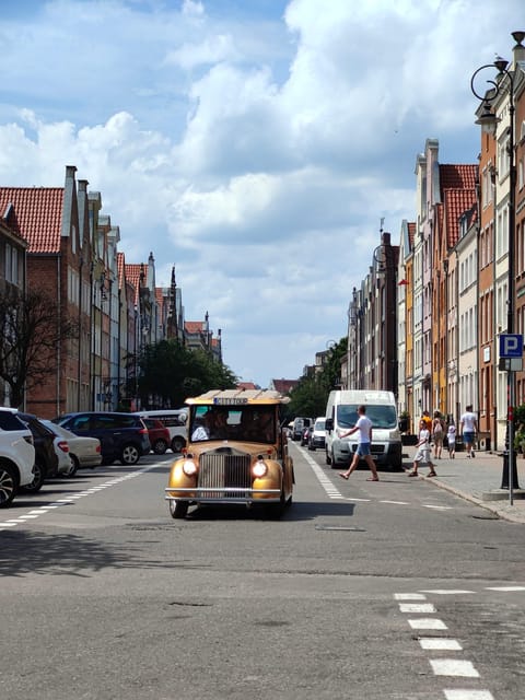 Gdansk: City Sightseeing Tour Eco Electric Buggy Golf Cart ! - Using the audio guide in Polish, English, or German without missing the story