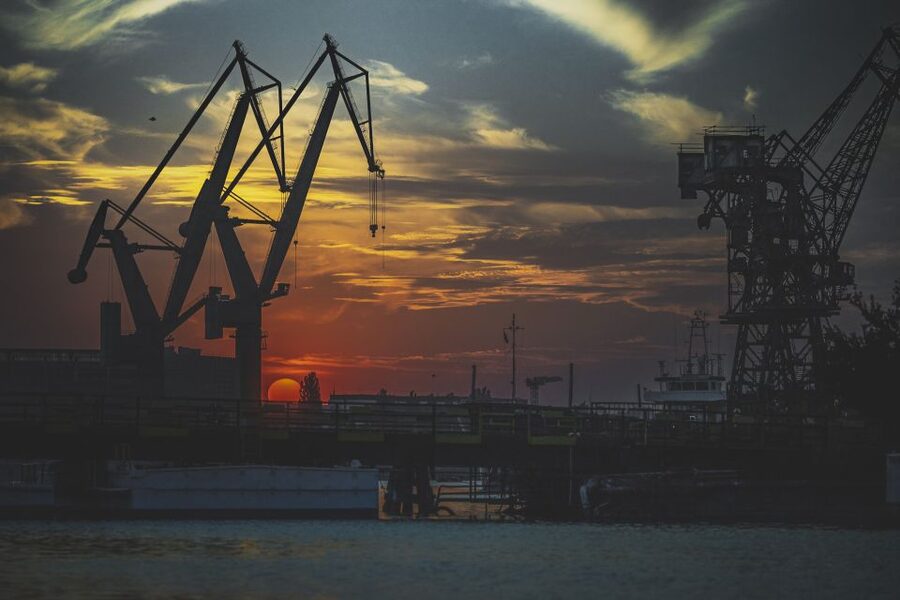 Gdańsk: Sunset Cruise on a Historic Polish Boat - Golden Hour Among Shipyard Cranes and Water-Edge Working Life