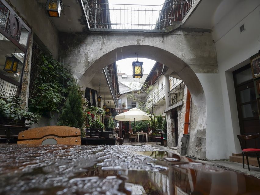 Krakow: Jewish Quarter and Schindler's Factory Guided Tour - Kazimierz, then and now: 14th century life to modern cafe streets