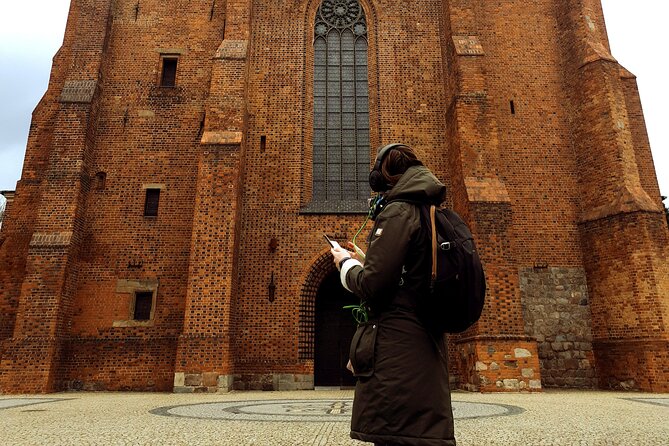 The Birthplace of Poland: A Self-Guided Audio Tour of Poznań - Śródka District and the old wall-art moment