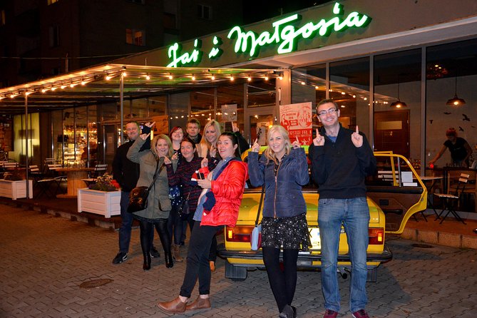 Warsaw Vodka Night Private Tour by Retro Fiat - Palace of Culture and Science at night, plus the story behind it